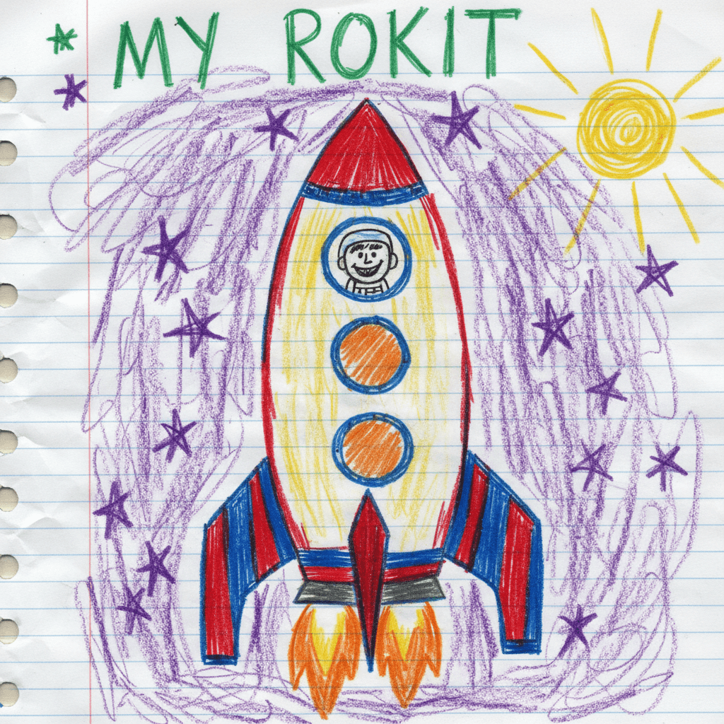 Child's original crayon drawing of a smiling rocket ship and astronaut